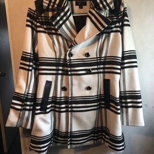 Women’s black & white trench coat.